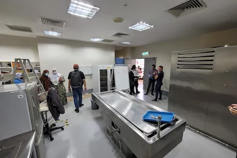 EMEC engineers and hospital staff reviewing a completed facility